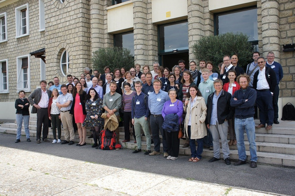 A group of people standing in front of a building.